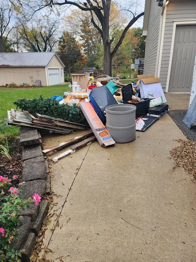 Dumpster being loaded with debris for Demolition Dumpster Rental in Killingworth
